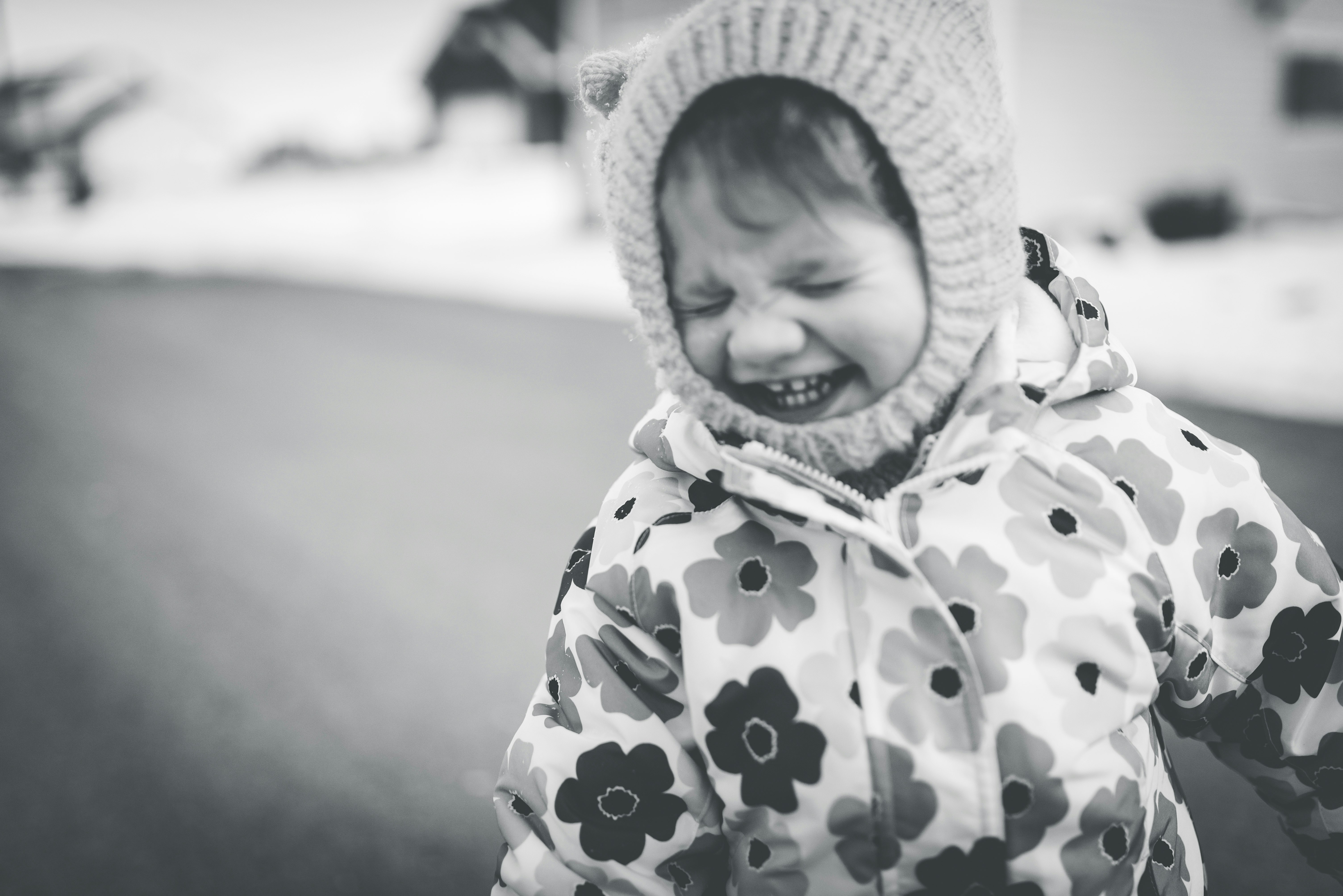 girl in floral coat smiling